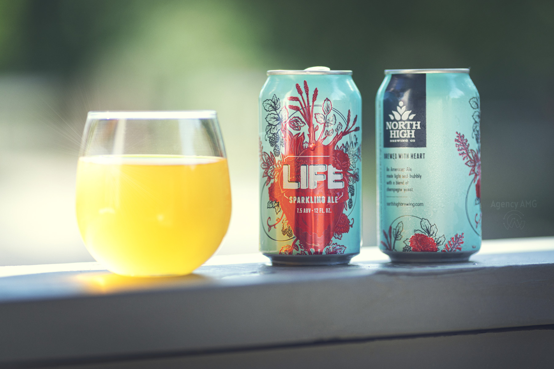 Craft beer can with dramatic splash and backlight rim